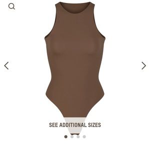 Skims Fits Everybody High Neck Bodysuit. Never worn with tags. Color Oxide
